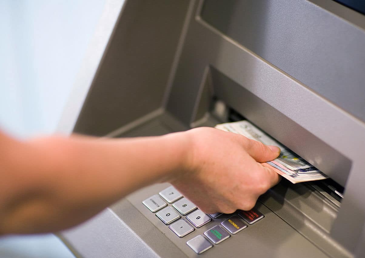 What do you do if your money gets stuck in a cash deposit machine?